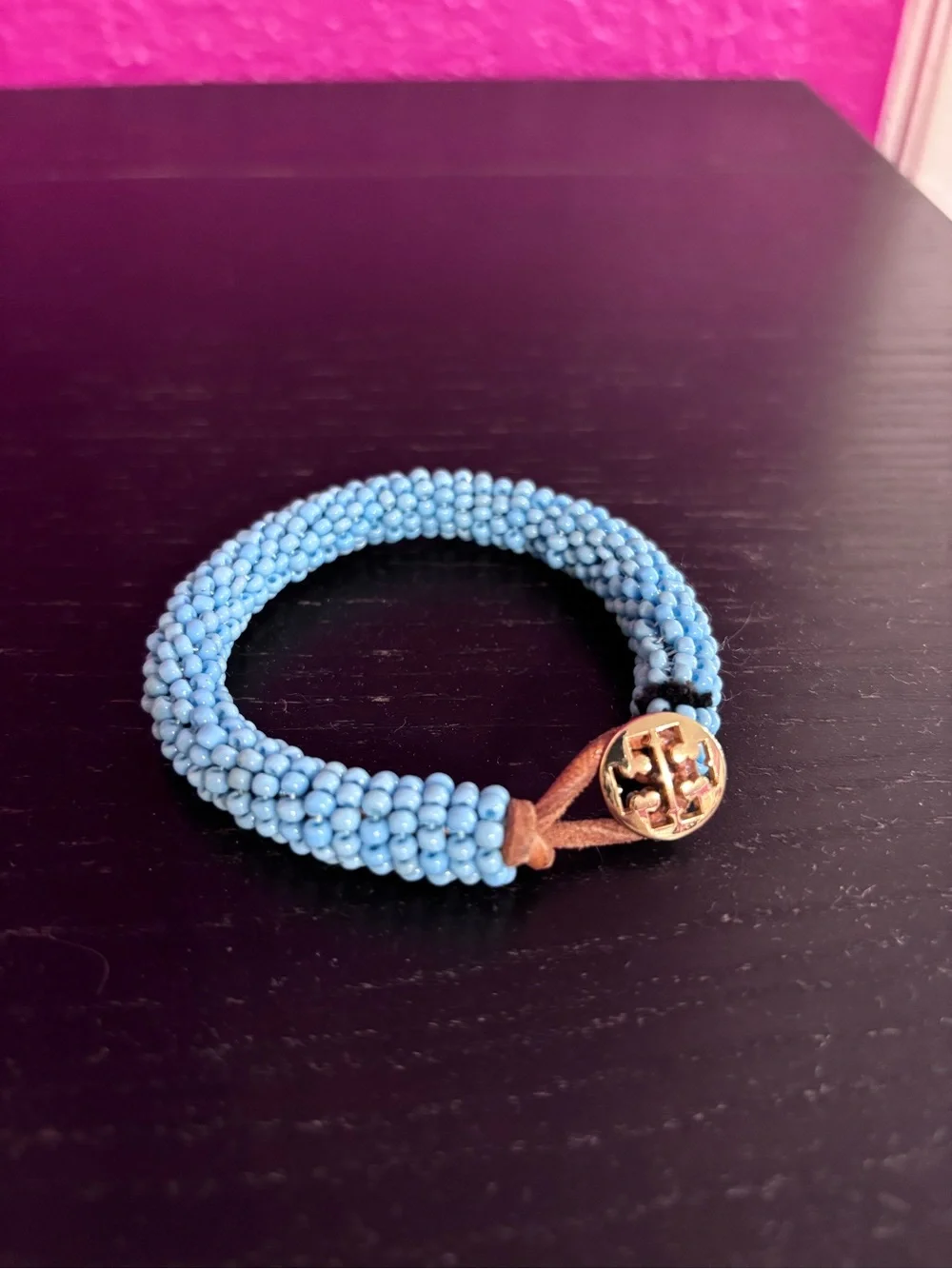 Tory Burch blue beaded bracelet with gold tone logo